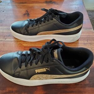 Puma black and gold Women's size 11